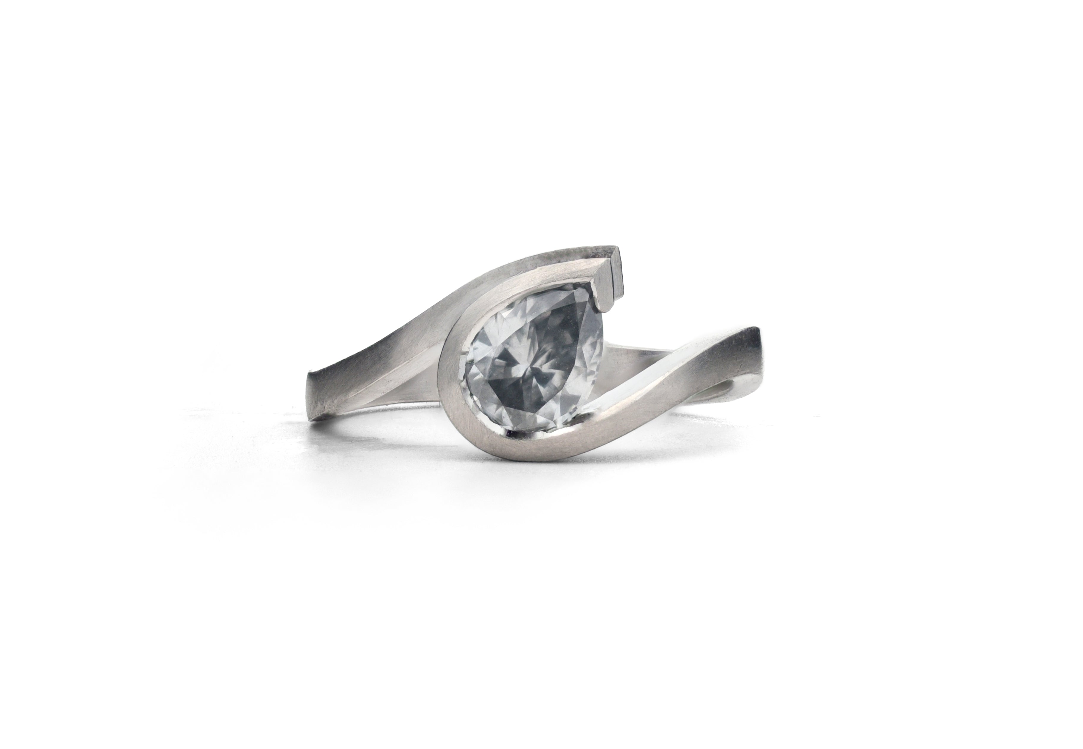 Platinum wave ring with pear shape grey diamond