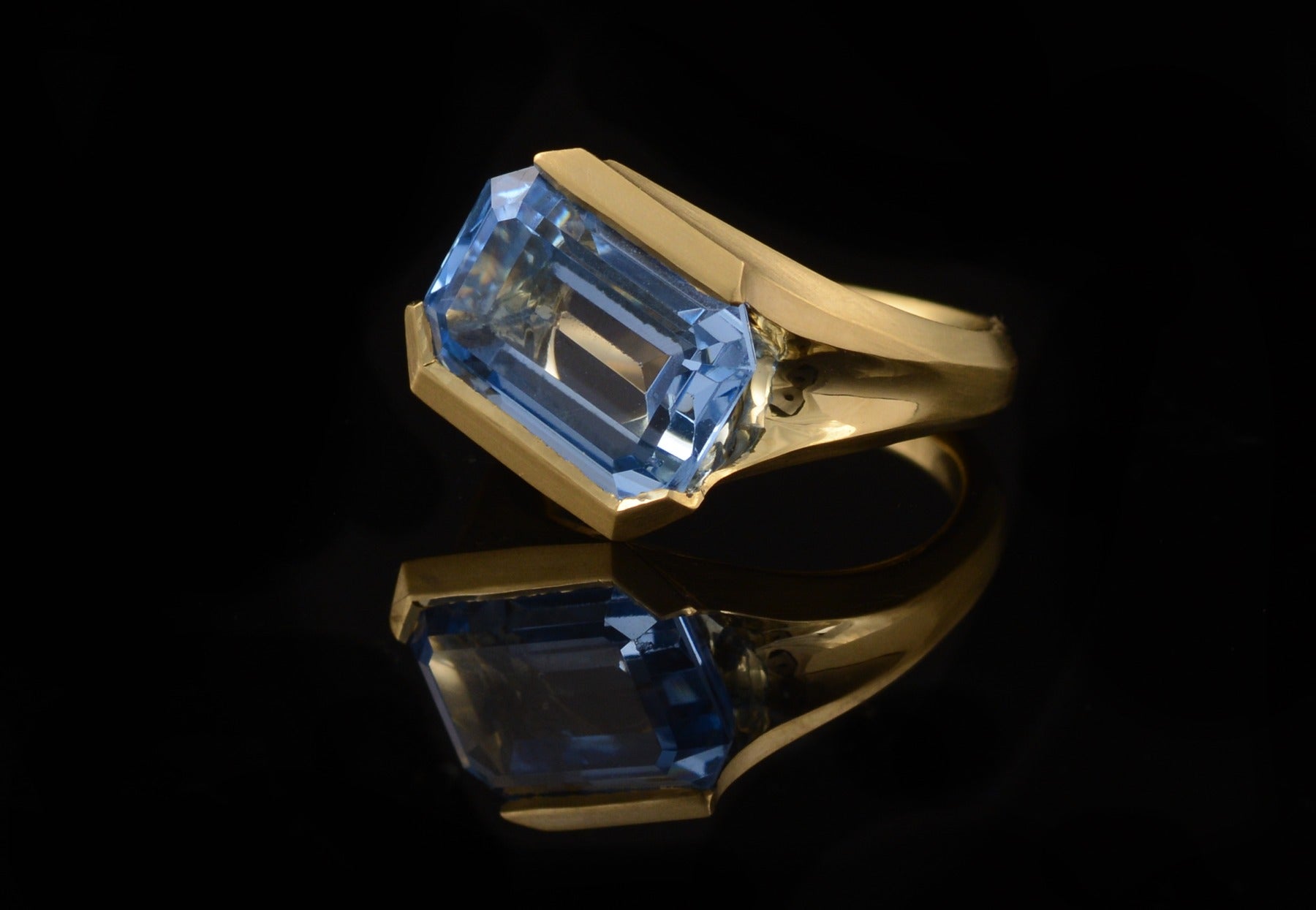 Hand carved gold ring commission with blue stone