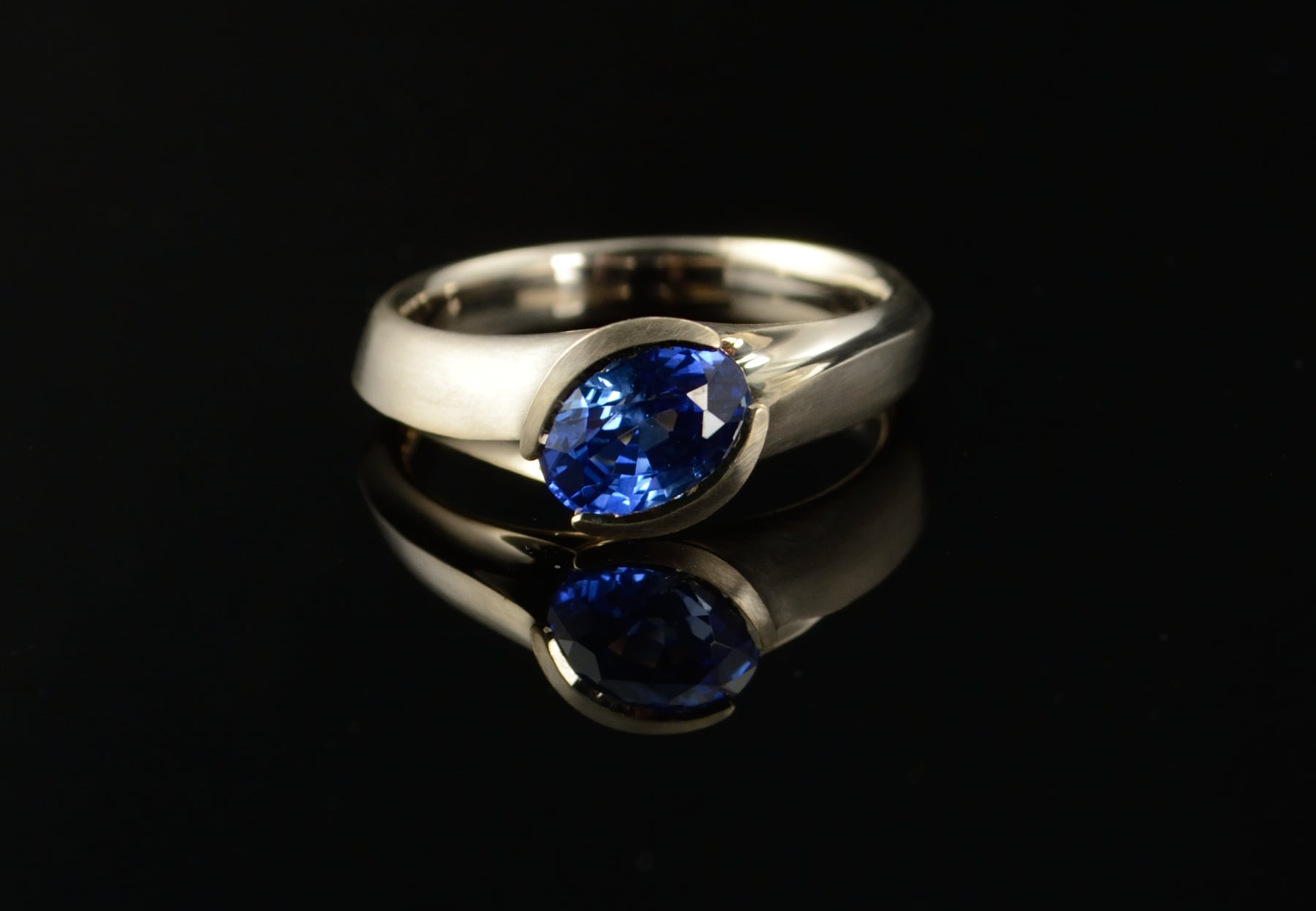 Carved white gold and sapphire engagement ring – McCaul