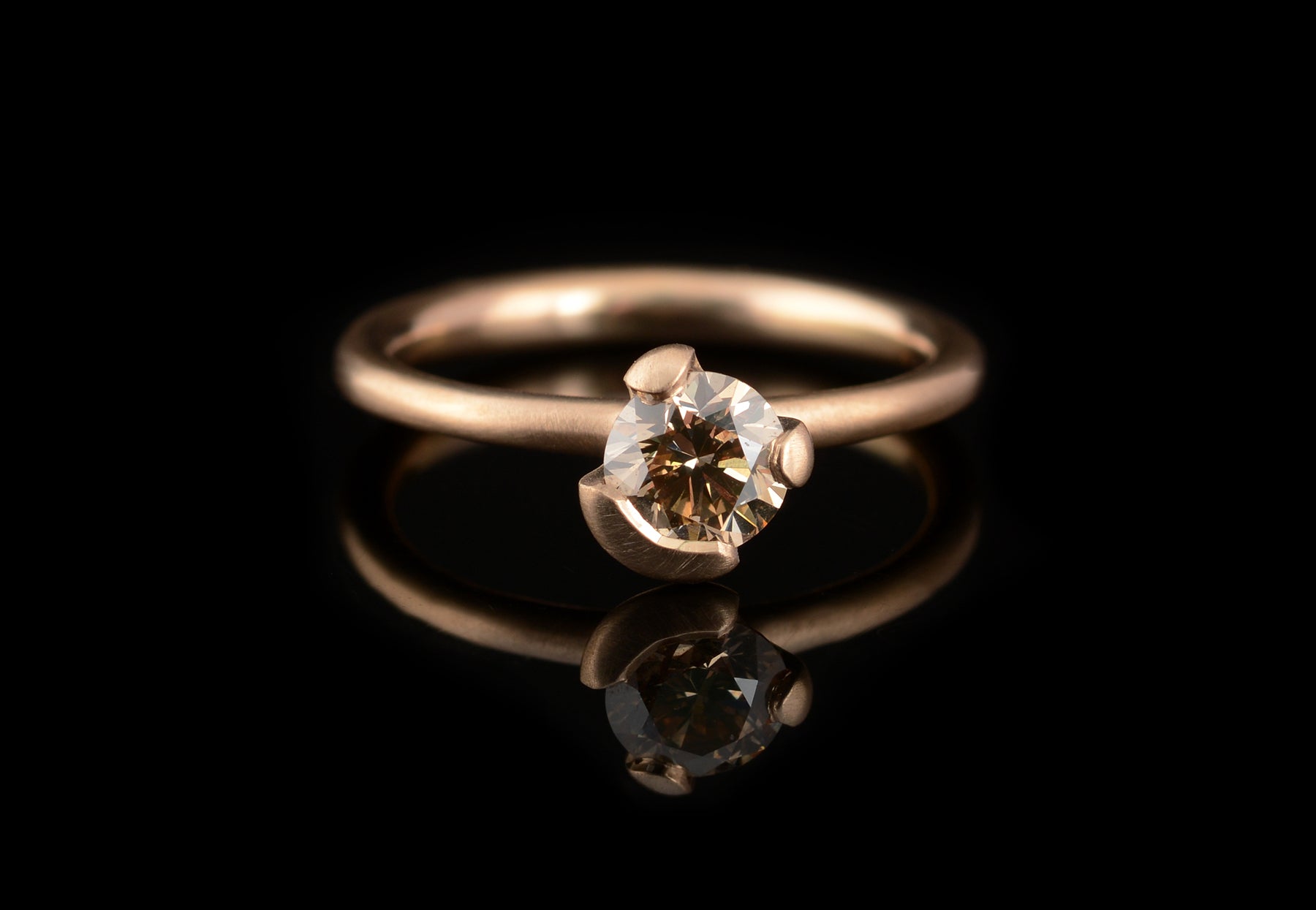 Asymmetric claw rose gold and cognac diamond engagement ring