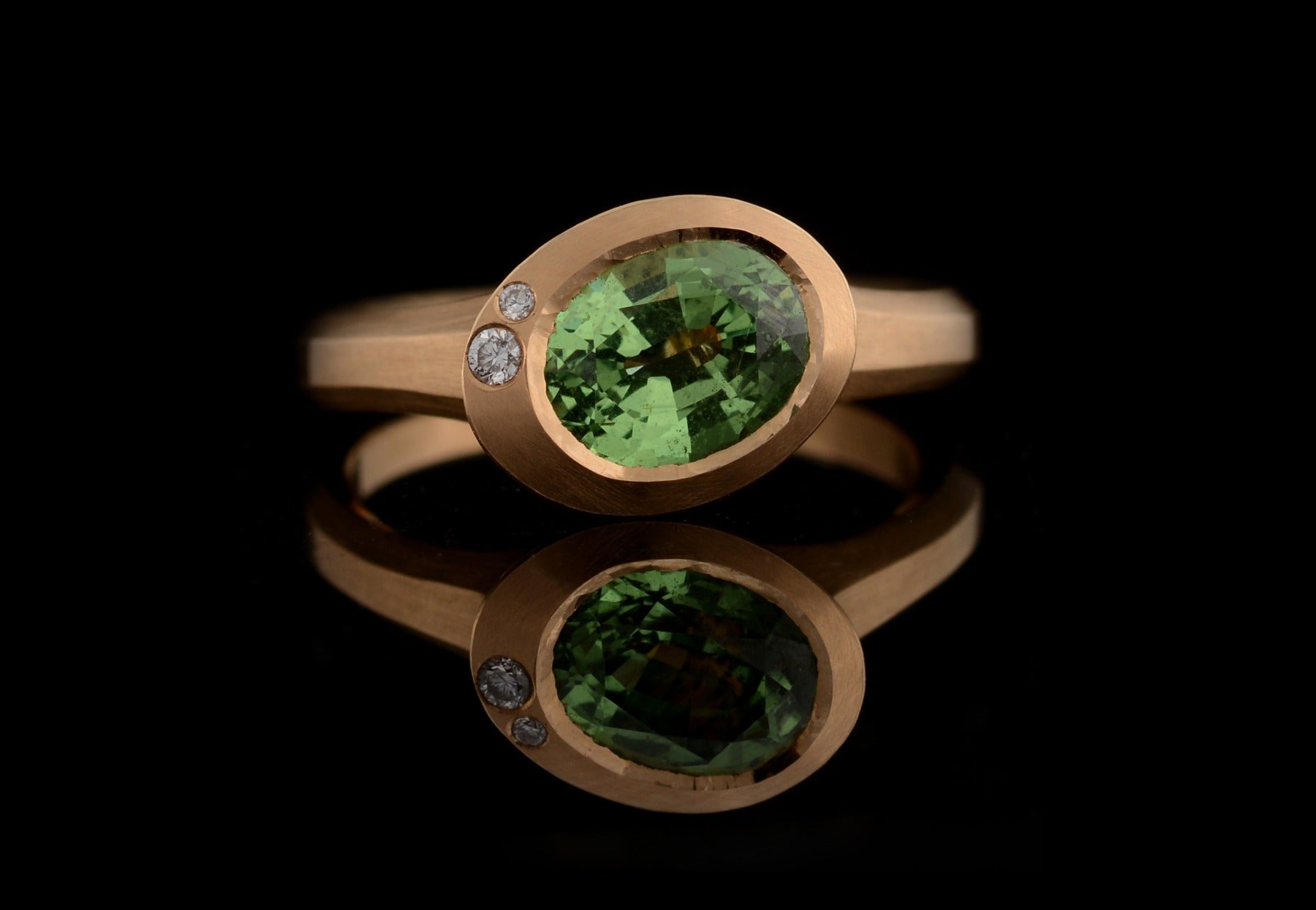 Arris oval tsavorite and white diamond rose gold ring