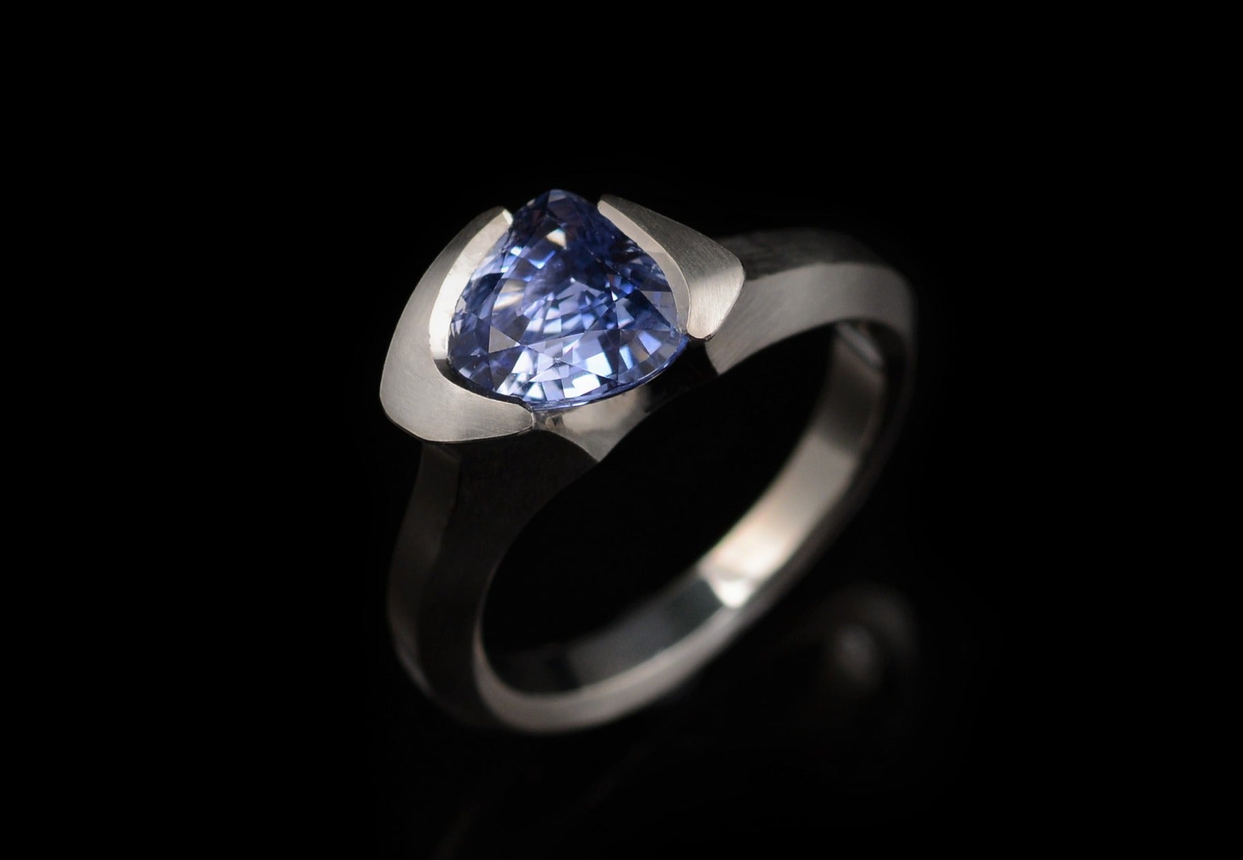 Carved trillion cut sapphire platinum ring