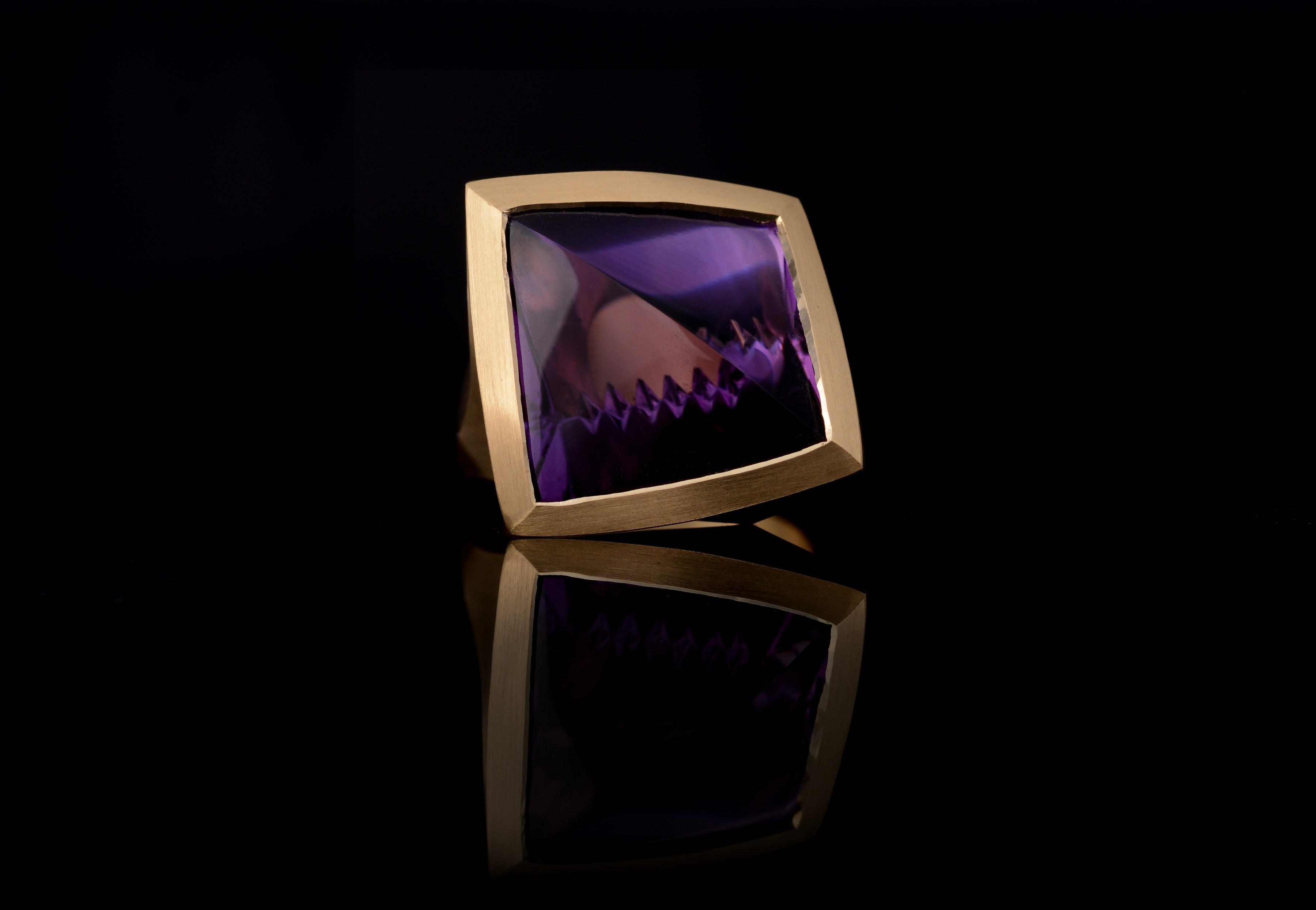 Arris: Fancy cut 16 carat amethyst set in yellow gold.-McCaul